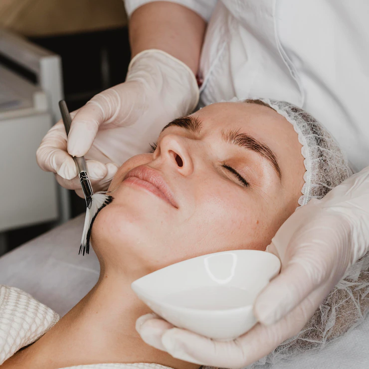 young-beautiful-woman-getting-face-skin-treatment_23-2148825378